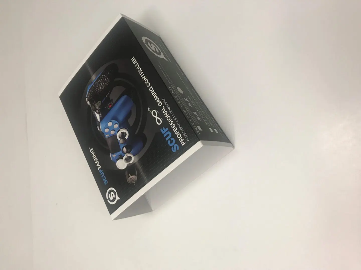 controller packaging black white and blue